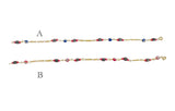 10 Karat Yellow Gold Genuine 4mm Azabache Jet and Blue or Red Lucky Eyes Figaro Link 7.5" Bracelet