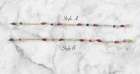 10 Karat Yellow Gold Genuine 4mm Azabache Jet and Blue or Red Lucky Eyes Figaro Link 7.5" Bracelet