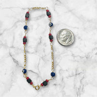 10 Karat Yellow Gold Genuine 4mm Azabache Jet and Blue or Red Lucky Eyes Figaro Link 7.5" Bracelet