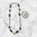 10 Karat Yellow Gold Genuine 4mm Azabache Jet and Blue or Red Lucky Eyes Figaro Link 7.5" Bracelet