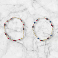 10 Karat Yellow Gold Genuine 4mm Azabache Jet and Blue or Red Lucky Eyes Figaro Link 7.5" Bracelet