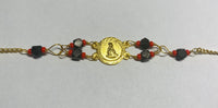 14 Karat Yellow Gold Genuine Azabache Jet-Coral "Caridad del Cobre" Medal 7" Curb Bracelet