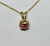 14 Karat Yellow Gold Genuine 5mm Round Ruby Pendant (Available with or without chain)