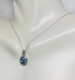 Sterling Silver Genuine Swiss Blue Topaz and Diamond Pendant with 18" Loose Rope Chain