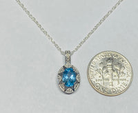 Sterling Silver Genuine Swiss Blue Topaz and Diamond Pendant with 18" Loose Rope Chain