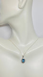 Sterling Silver Genuine Swiss Blue Topaz and Diamond Pendant with 18" Loose Rope Chain