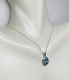 Sterling Silver Genuine Swiss Blue Topaz and Diamond Pendant with 18" Loose Rope Chain