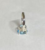 Sterling Silver and Genuine 12 x 10mm Oval Sky Blue Topaz Scroll Design Ladies Solitaire Ring