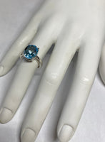 Sterling Silver and Genuine 12 x 10mm Oval Sky Blue Topaz Scroll Design Ladies Solitaire Ring