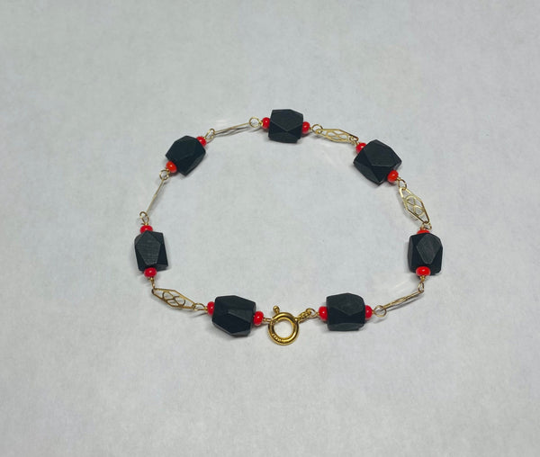 14 Karat Yellow Gold Filled Genuine 7mm Azabache Jet and Coral Accent 7.5" Plaque Bracelet