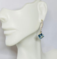 14 Karat White and Yellow Gold Genuine Sky Blue Topaz and Diamond Dangle Post Earrings