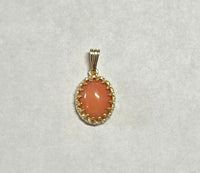 14 Karat Yellow Gold Genuine 10 x 8mm Oval Cabochon Pink Coral Pendant in Crown Style Setting