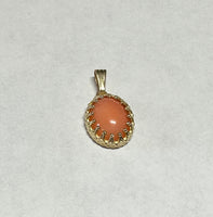 14 Karat Yellow Gold Genuine 10 x 8mm Oval Cabochon Pink Coral Pendant in Crown Style Setting