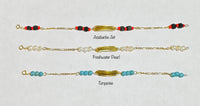 10 Karat Yellow Gold Genuine 4mm Azabache Jet, Freshwater Pearl or Turquoise 5.75" Personalizable Baby ID Figaro Bracelet