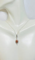 Sterling Silver and 8 x 6mm Oval Brown Goldstone "Venturina" Leaf Motif Pendant with 18" Chain