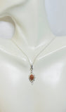 Sterling Silver and 8 x 6mm Oval Brown Goldstone "Venturina" Leaf Motif Pendant with 18" Chain