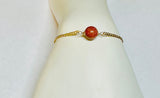 10 Karat Yellow Gold Curb Link Bracelet with 9mm Brown Goldstone Venturina Bead