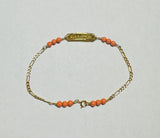 10 Karat Yellow Gold 3mm Simulated Pink Coral 6.5" Figaro Link "Dios Me Bendiga OR God Bless Me" Baby Bracelet